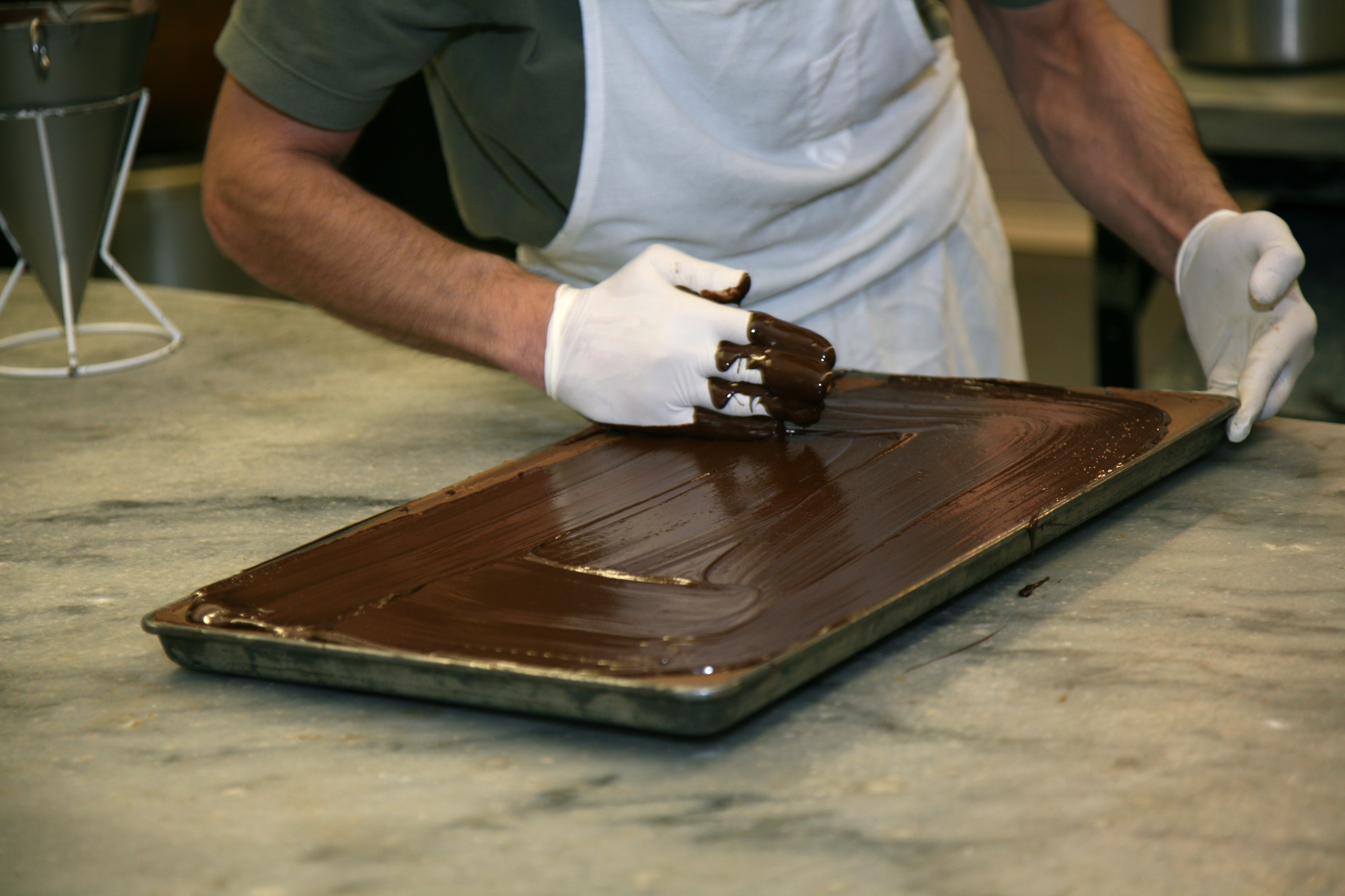 Hazelnut Truffle Squares Coated in Chocolate Behind the Union Symbol